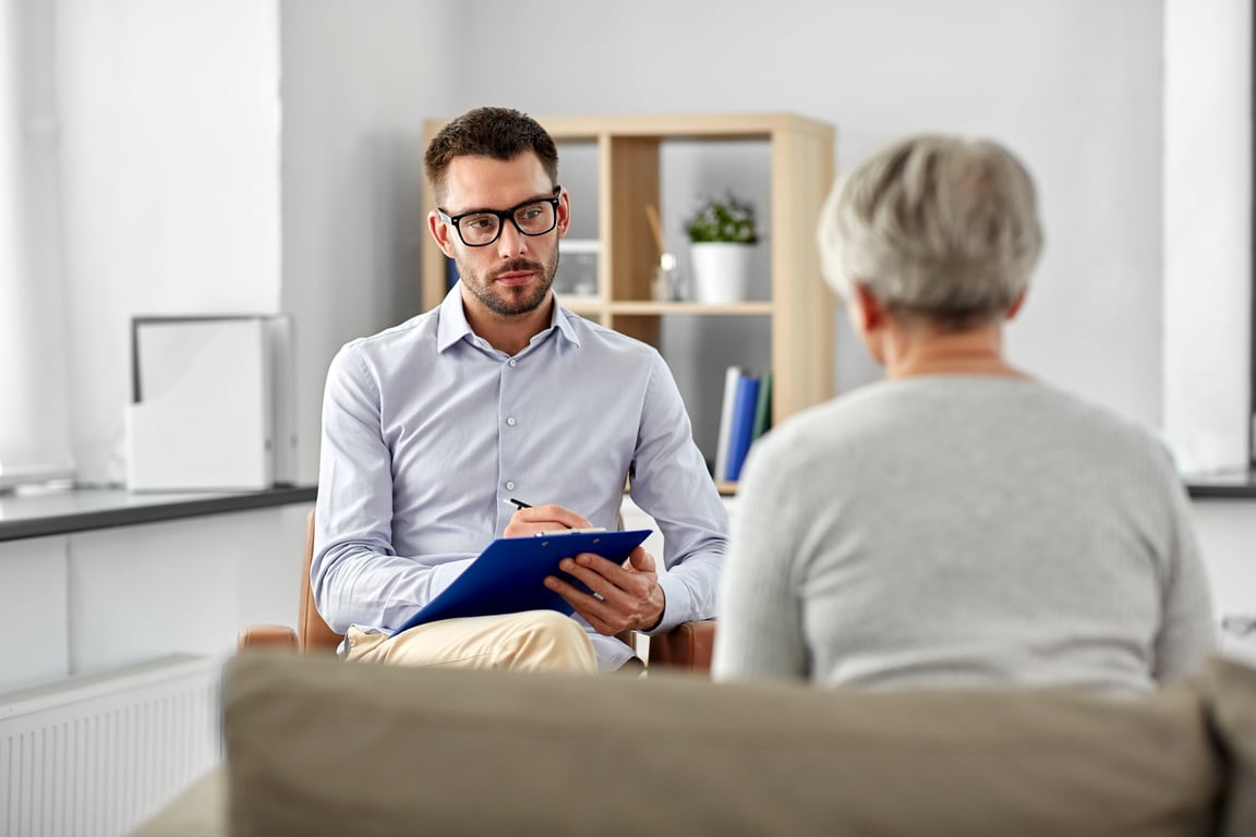 Psychologist Listening to Senior Woman Patient